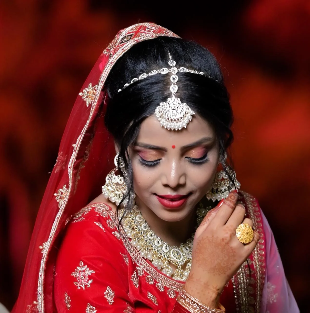 Side profile bridal makeup with polished contour and glow